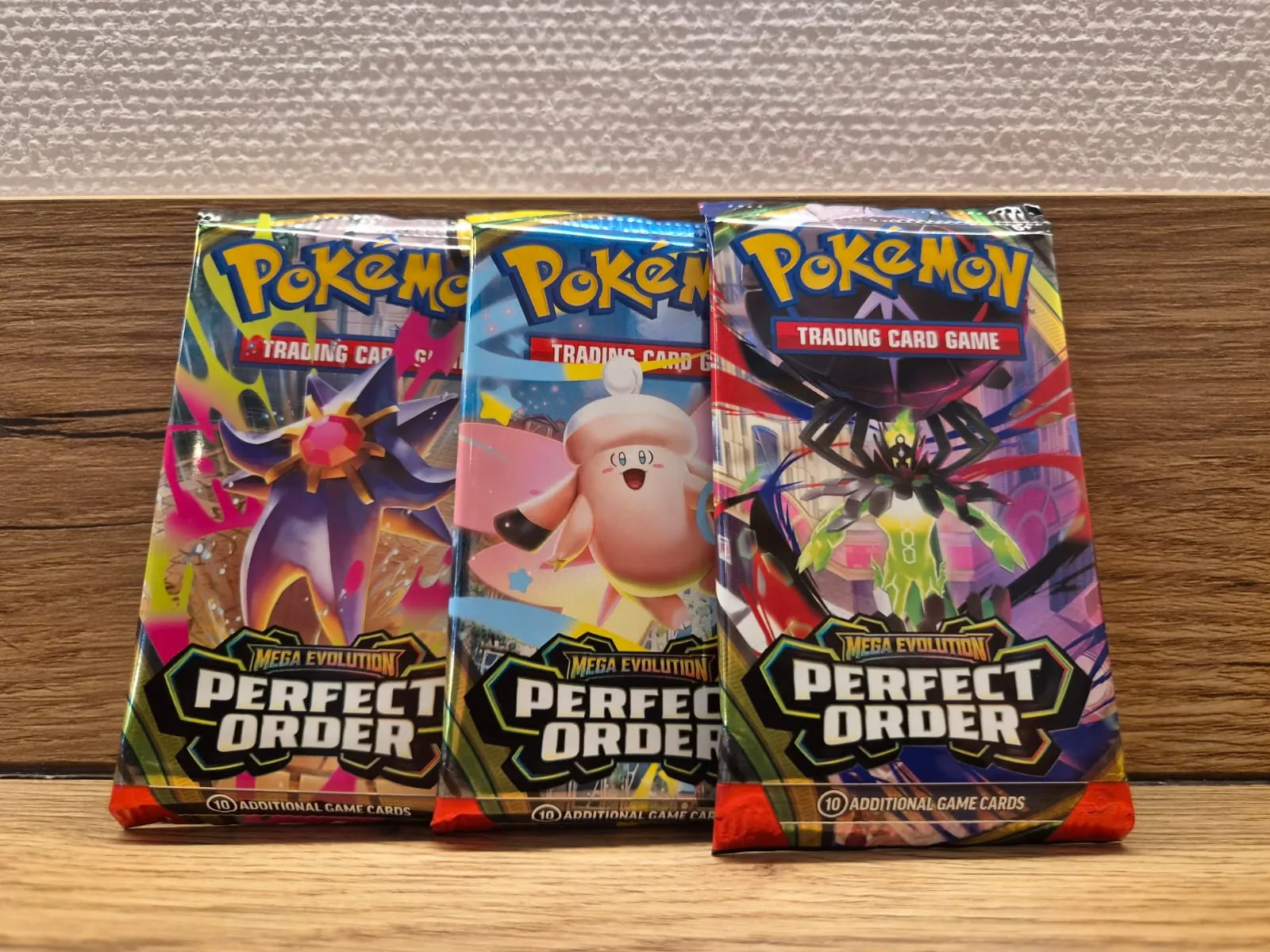 Drie originele Pokémon Perfect Order booster packs uit de Mega Evolution uitbreiding