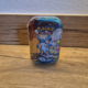 Pokémon Scarlet & Violet Prismatic Evolutions Mini Tin met Glaceon artwork.
