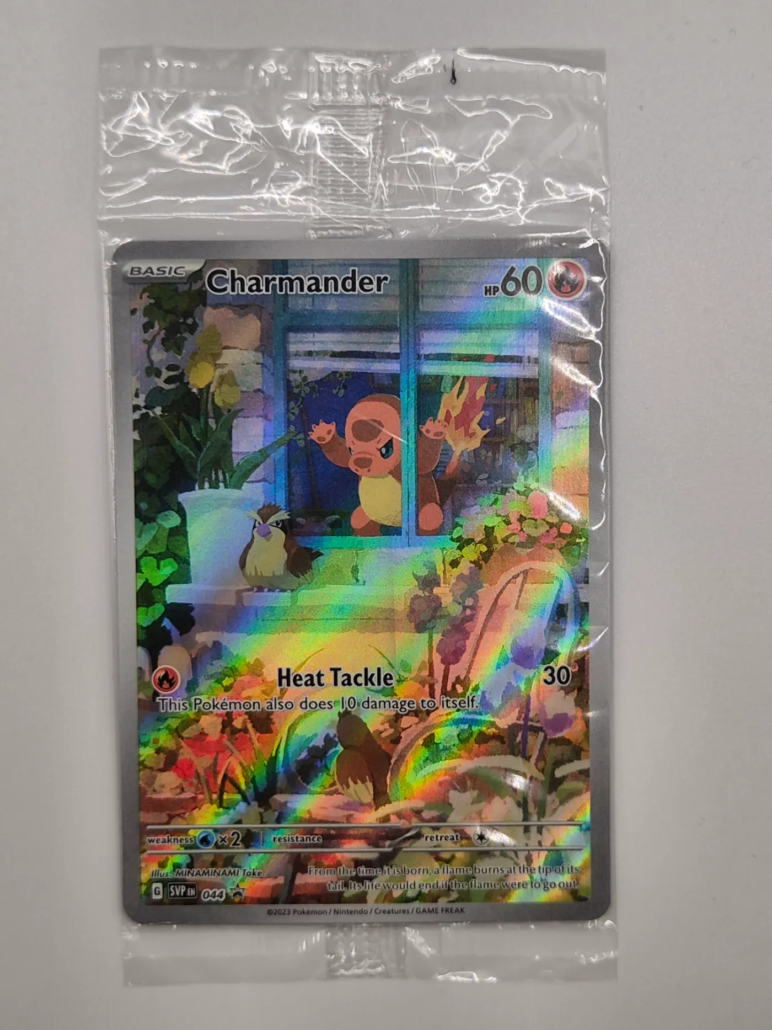 Voorkant van Charmander 044 uit Scarlet & Violet Black Star Promos, een promo-kaart met artwork van MINAMINAMI Take